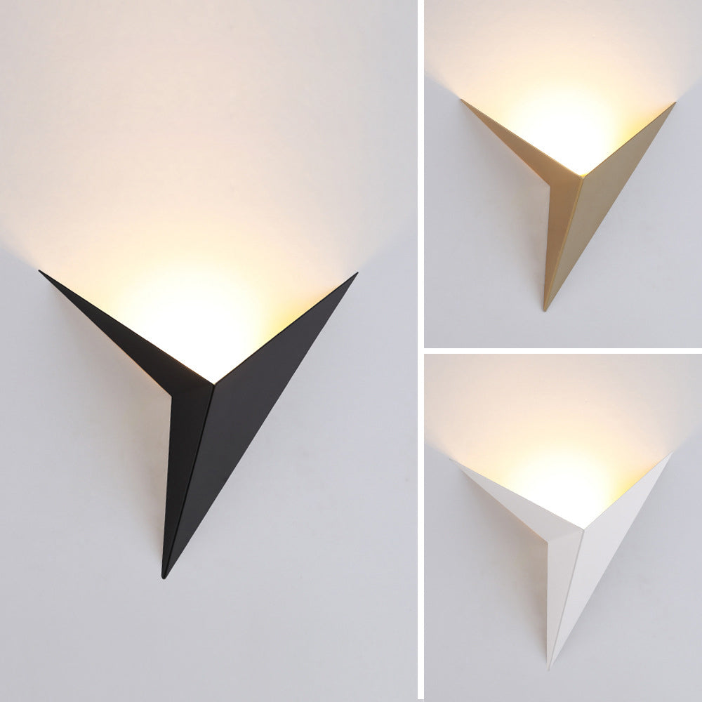 Geometric triangle wall light in black gold and white all three finishes lit