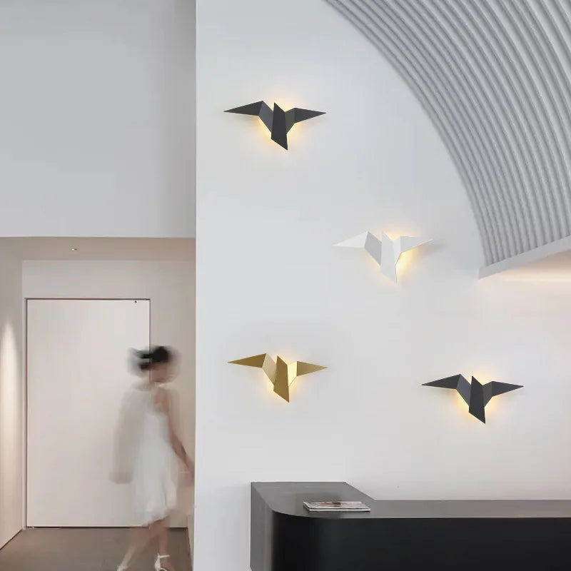 Multiple origami bird wall lights black white gold in modern hallway