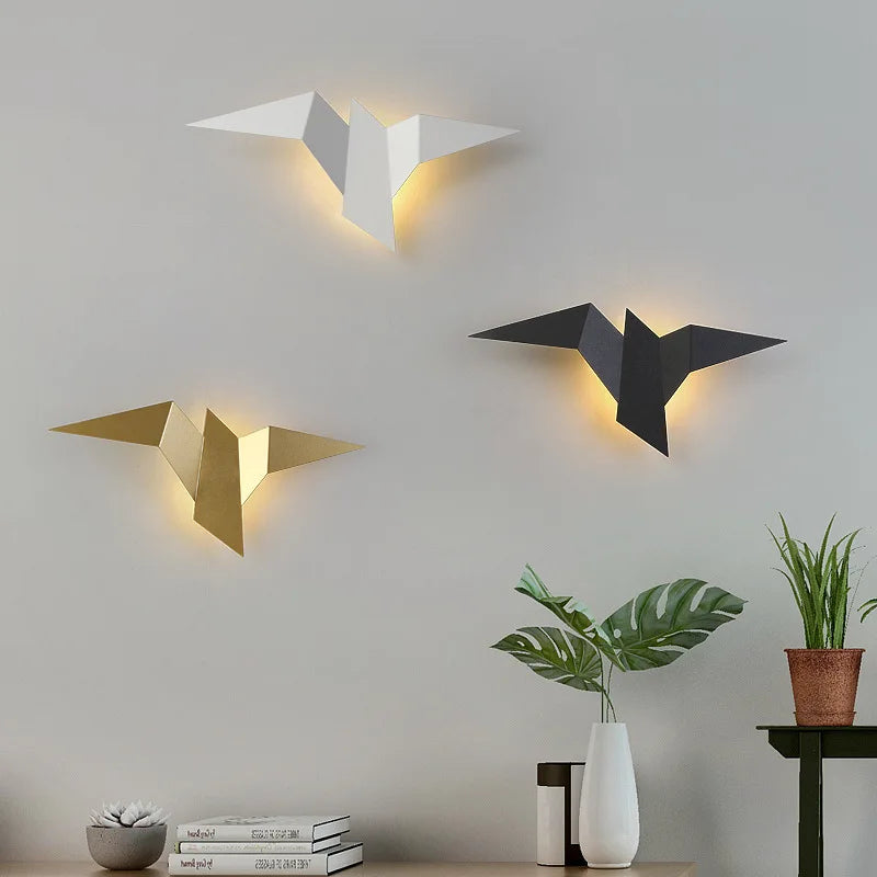 Origami bird wall sconce in black gold and white three finishes lit